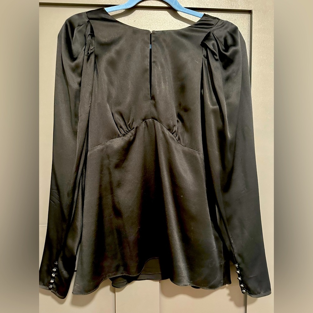 Beautiful black BCBG Maxazria top. Size small,  with delicate button sleeve